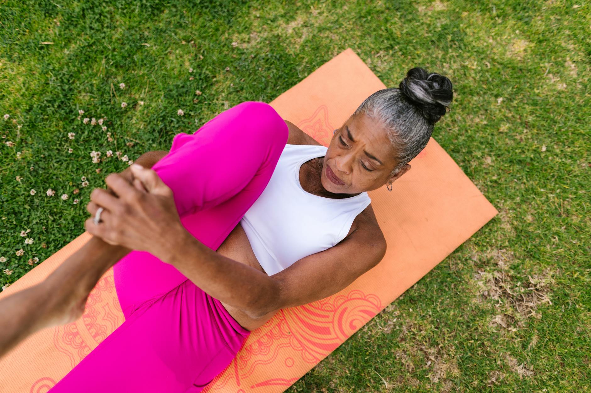 elderly woman doing a leg stretching