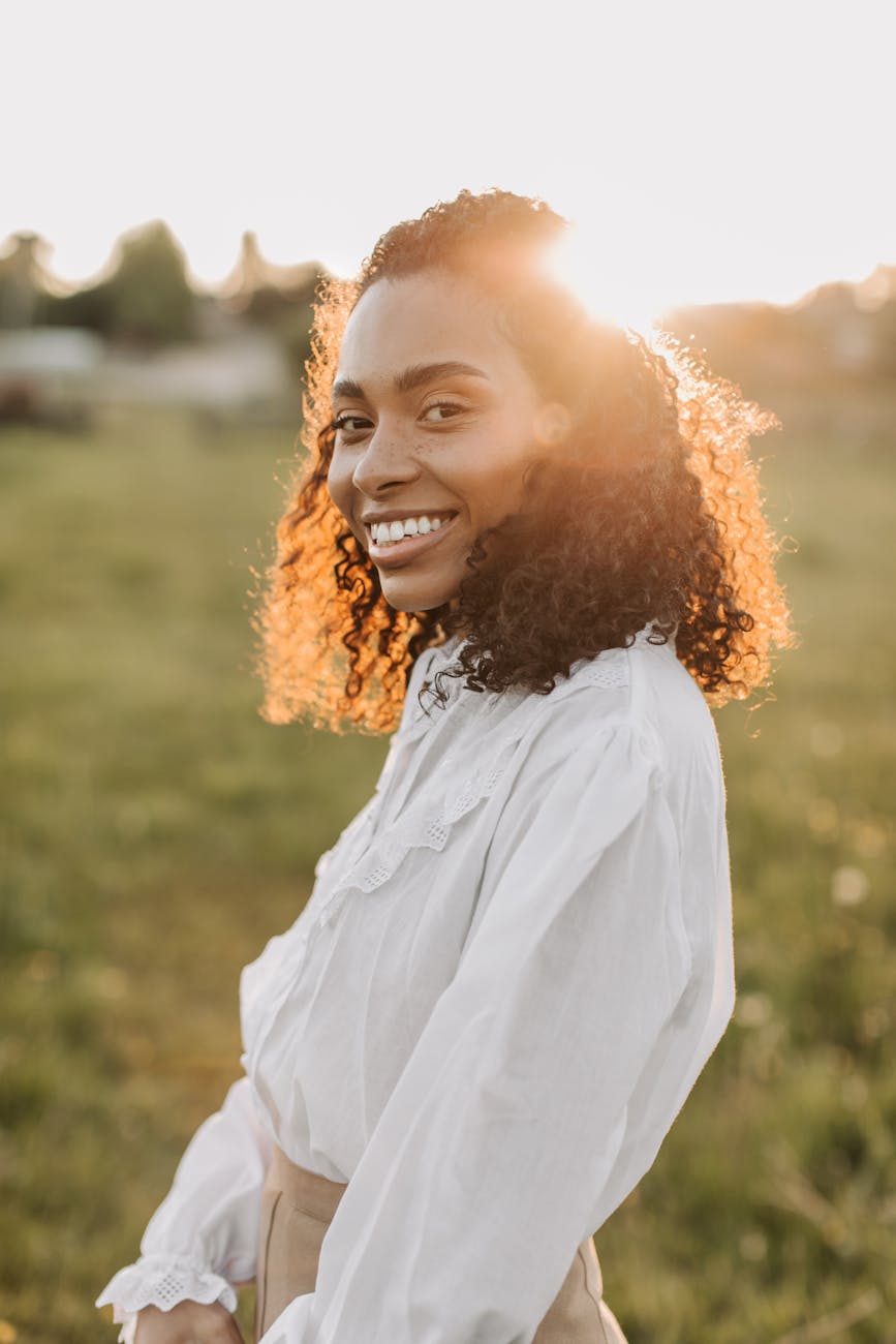 smiling woman in white dress shirt