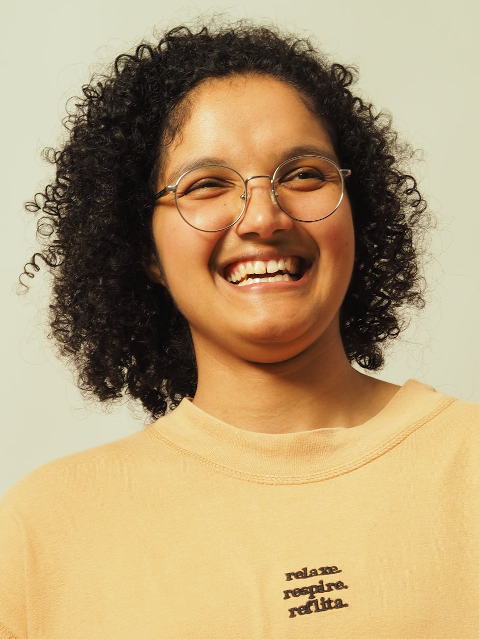 smiling person with glasses in casual wear