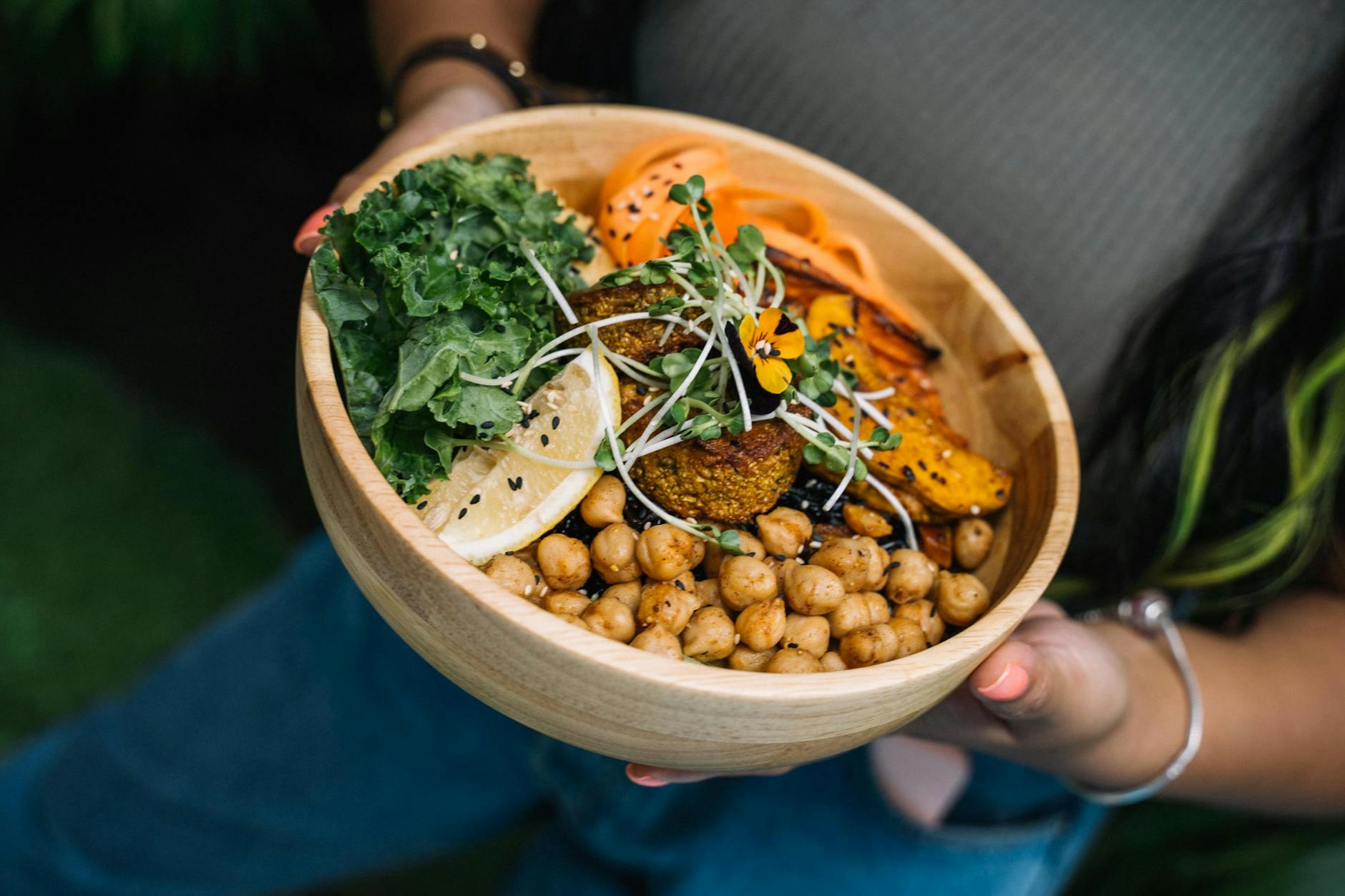 person holding a bowl with food